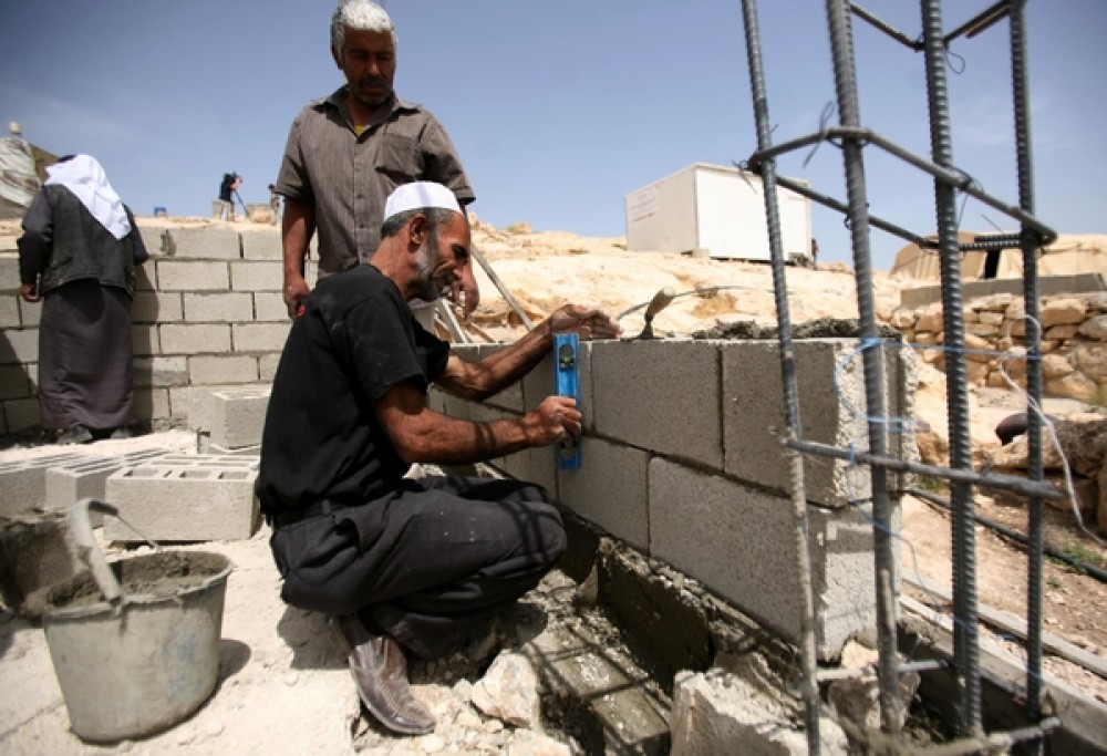 عمال بناء بغزة