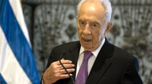Peres threatens to cut aid to Gaza
