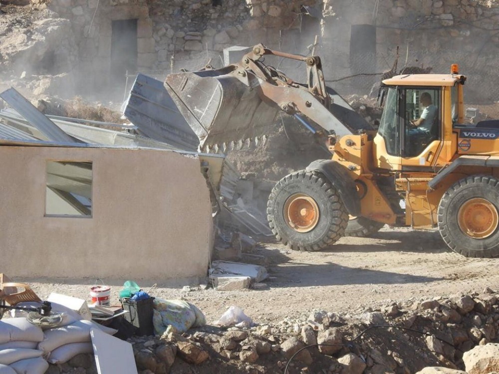 Israeli forces demolish “barracks”, seize bulldozer in occupied WB